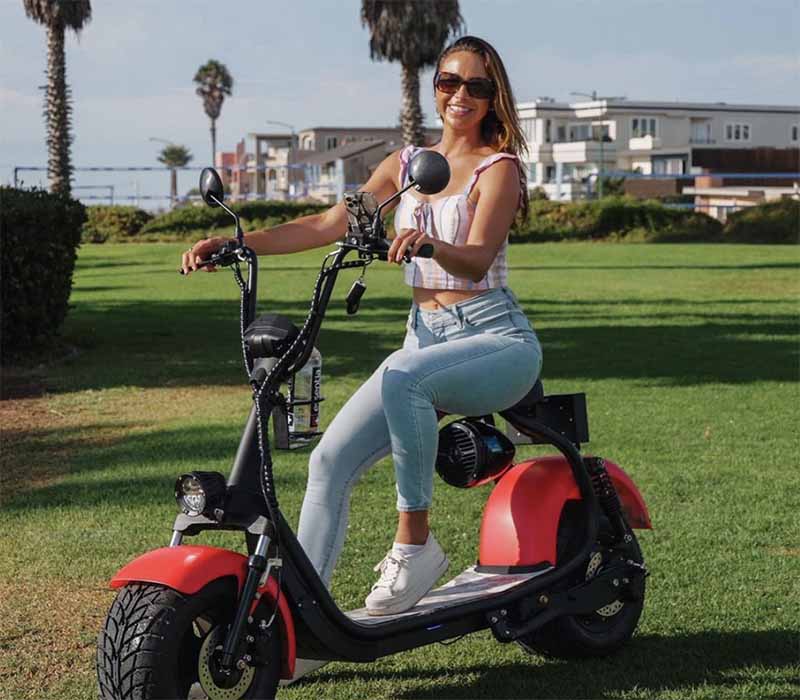 woman on phat scooter in park
